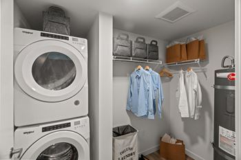 A laundry room with a washing machine and a dryer